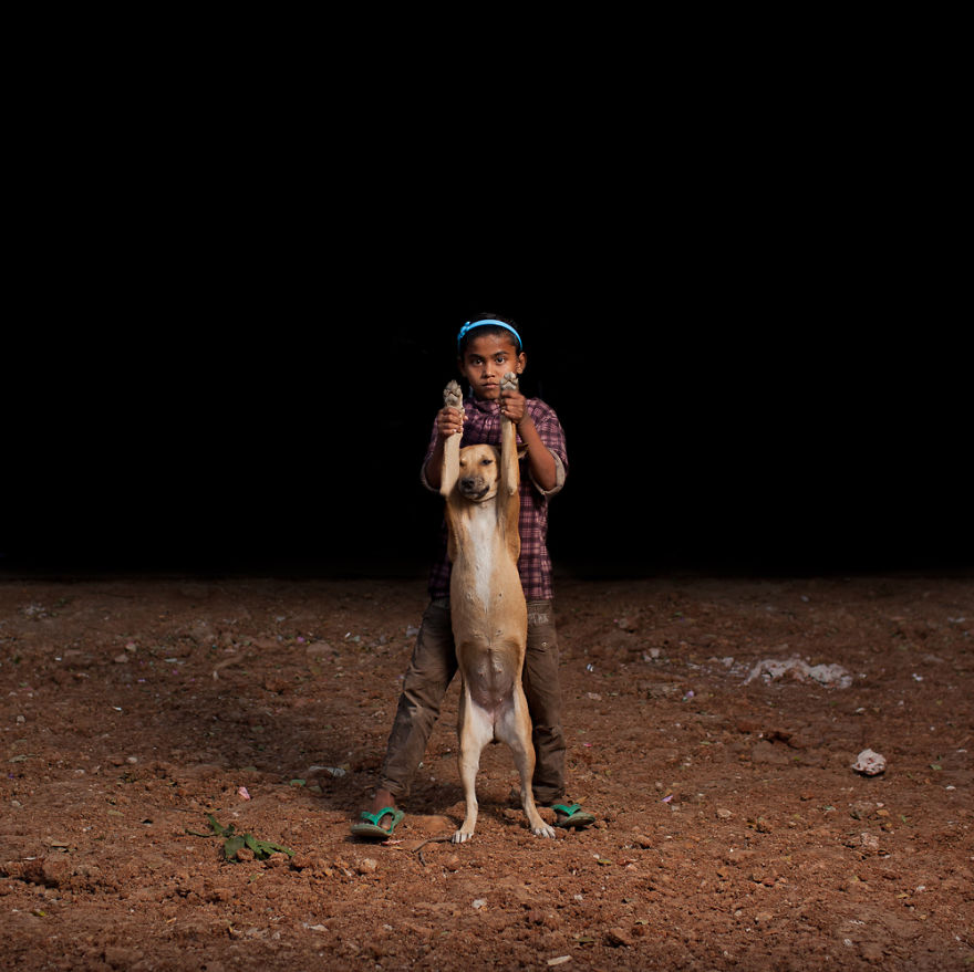 Orphan Boys Share Food With Dogs